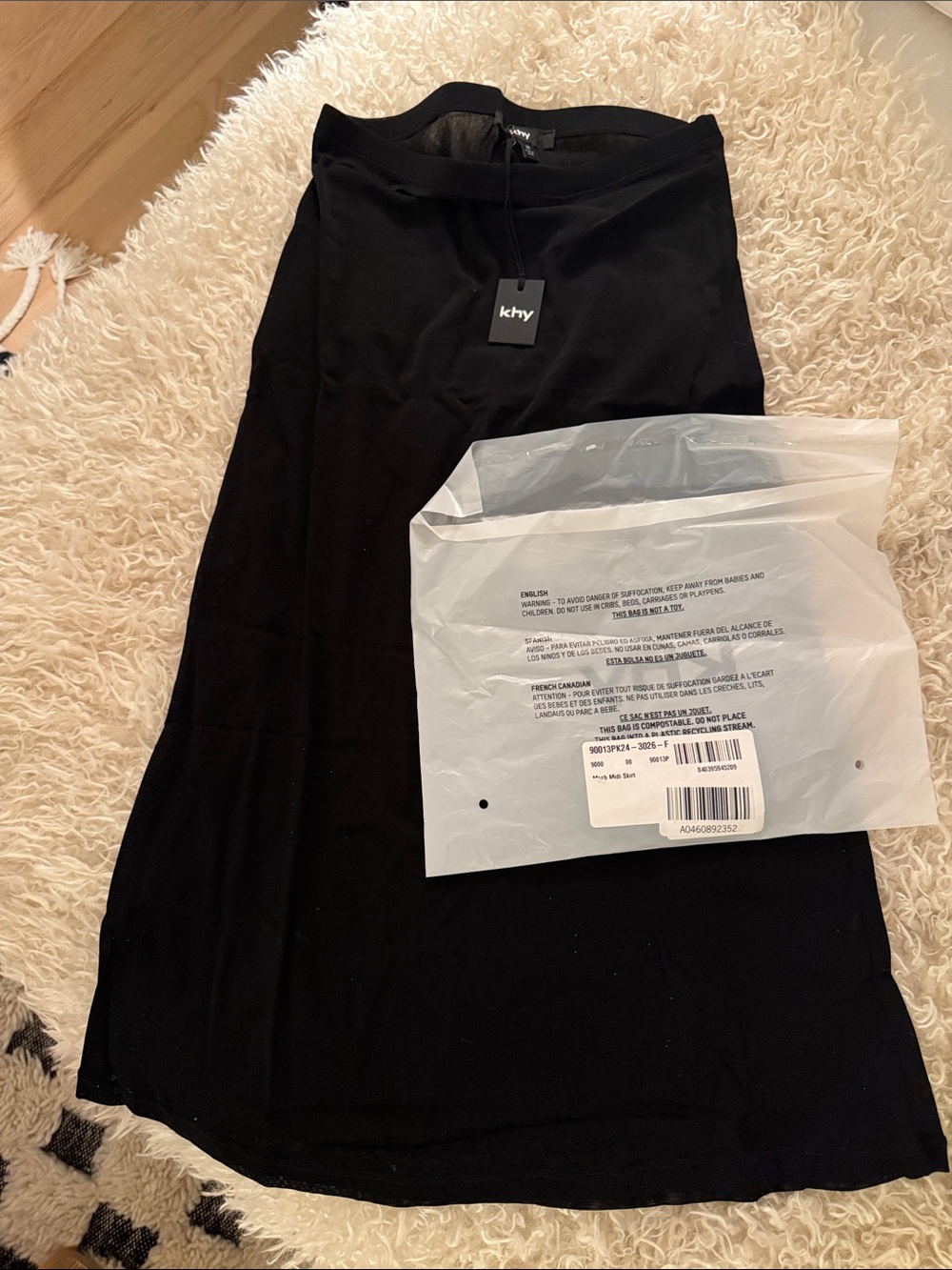 A sheer midi skirt made from a lightweight, single-layer mesh fabric.100% Nylon - Picture 4 of 4